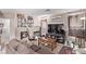 Comfortable living room with a fireplace, offering a relaxing atmosphere and ample space for entertainment at 4919 Rancho Domingo Ct, North Las Vegas, NV 89031