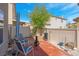 Cozy backyard area with seating, a fire pit, and minimal, easy to maintain landscaping at 4992 W Moberly Ave, Las Vegas, NV 89139