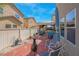 Inviting backyard featuring a cozy seating area, complete with a built-in grill and outdoor kitchen under a shaded patio at 4992 W Moberly Ave, Las Vegas, NV 89139