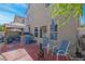 Backyard view of outdoor living space featuring built-in grill, covered patio, hot tub, and seating at 4992 W Moberly Ave, Las Vegas, NV 89139