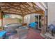 Relaxing backyard featuring a covered patio, hot tub, comfortable seating, and outdoor grill at 4992 W Moberly Ave, Las Vegas, NV 89139