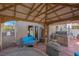 Outdoor living space featuring a built-in grill, covered patio, hot tub, and comfortable seating at 4992 W Moberly Ave, Las Vegas, NV 89139