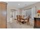 Formal dining room showcasing neutral paint, ceramic tile, chandelier and natural light at 4992 W Moberly Ave, Las Vegas, NV 89139