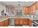 Spacious kitchen with wooden cabinets, stainless steel appliances and backsplash at 4992 W Moberly Ave, Las Vegas, NV 89139