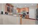 Well-equipped kitchen features stainless steel appliances, granite countertops, and abundant wood cabinetry at 4992 W Moberly Ave, Las Vegas, NV 89139