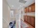 Upstairs hallway featuring wood floors, built-in cabinets and access to other rooms at 4992 W Moberly Ave, Las Vegas, NV 89139