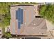 This is an aerial view of the house with solar panels and a backyard fire pit at 51 La Fiesta St, Henderson, NV 89012