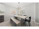 Bright dining room with modern table and bench seating under a stylish chandelier at 51 La Fiesta St, Henderson, NV 89012
