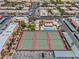 Overhead shot showcasing tennis courts and a pool within a vibrant residential community at 5185 Indian River Dr # 229, Las Vegas, NV 89103