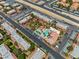 Expansive aerial view of a community with a pool, lush green landscaping, and convenient parking at 5185 Indian River Dr # 229, Las Vegas, NV 89103