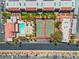 Aerial view showcasing well-maintained tennis courts and a swimming pool within a beautifully landscaped community at 5185 Indian River Dr # 229, Las Vegas, NV 89103