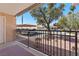 Balcony offers exterior landscaping views including parking and trees, with a doorway to the home at 5185 Indian River Dr # 229, Las Vegas, NV 89103