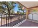 This covered balcony features a full-sized washer and dryer, offering convenience with views of the neighborhood's mature landscaping at 5185 Indian River Dr # 229, Las Vegas, NV 89103