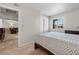 Neutral bedroom featuring a cozy bed and a window letting in natural light at 5185 Indian River Dr # 229, Las Vegas, NV 89103