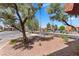 Well-maintained front yard showcasing mature trees and attractive landscaping, enhancing curb appeal at 5185 Indian River Dr # 229, Las Vegas, NV 89103