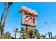 Community monument sign reads 'Bella Vita' with a manicured tropical landscape under a bright blue sky at 5185 Indian River Dr # 229, Las Vegas, NV 89103