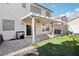 Spacious backyard featuring a covered patio with outdoor seating, grill, and basketball hoop at 5220 Remini Ct, Las Vegas, NV 89130