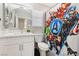 Bright bathroom featuring a modern vanity and unique Avengers themed shower curtain at 5220 Remini Ct, Las Vegas, NV 89130