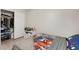 A bedroom with closet, single bed, ceiling fan and small nightstand at 5220 Remini Ct, Las Vegas, NV 89130