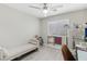 A brightly lit bonus bedroom with a day bed, ceiling fan and lots of space at 5220 Remini Ct, Las Vegas, NV 89130