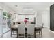 Bright dining area with access to the backyard and an open view of the modern kitchen at 5220 Remini Ct, Las Vegas, NV 89130