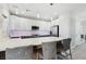 Modern kitchen with white cabinetry, stainless steel appliances, and a large kitchen island at 5220 Remini Ct, Las Vegas, NV 89130