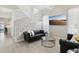 Bright living room with a staircase, comfortable seating, and a modern design at 5220 Remini Ct, Las Vegas, NV 89130