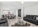 Spacious living room showcasing modern furnishings and an open layout, with hardwood flooring at 5220 Remini Ct, Las Vegas, NV 89130
