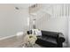 Open living space with comfortable seating, staircase, and abundant natural light at 5220 Remini Ct, Las Vegas, NV 89130
