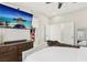 A bright and spacious main bedroom with dark wood dresser and ceiling fan at 5220 Remini Ct, Las Vegas, NV 89130