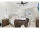 Modern bedroom with a designer accent wall, large windows, and neutral décor at 5220 Remini Ct, Las Vegas, NV 89130