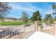 Balcony view overlooking a lush golf course, providing a serene and picturesque setting for relaxation at 5329 La Patera Ln, Las Vegas, NV 89149