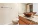 Bathroom with decorative bowl sink, granite counters and neutral fixtures at 5329 La Patera Ln, Las Vegas, NV 89149