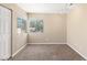 Bright bedroom features carpet flooring, neutral walls, and a pair of windows at 5329 La Patera Ln, Las Vegas, NV 89149
