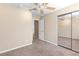Neutral bedroom features carpet floors, ceiling fan, and mirrored closet at 5329 La Patera Ln, Las Vegas, NV 89149