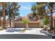 Charming two-story home featuring a spacious three-car garage and a beautifully landscaped front yard with mature trees at 5329 La Patera Ln, Las Vegas, NV 89149