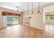 Bright living room with tile floor, fireplace, and sliding glass doors to a patio at 5329 La Patera Ln, Las Vegas, NV 89149