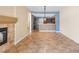 The spacious open floor plan features a fireplace, tile floors, and kitchen access at 5329 La Patera Ln, Las Vegas, NV 89149