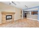 Living area with open floor plan, tile floors, fireplace, and access to the kitchen at 5329 La Patera Ln, Las Vegas, NV 89149