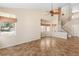 Open-concept living area showcasing vaulted ceilings, elegant staircase, and ample natural light from oversized windows at 5329 La Patera Ln, Las Vegas, NV 89149