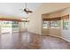 Bright living room with a golf course view through sliding glass doors, offering scenic views and easy outdoor access at 5329 La Patera Ln, Las Vegas, NV 89149