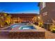 Lush backyard features a pristine pool and spa combination, with ample space for outdoor entertainment and relaxation by the water at 5523 Kyle Peak Ct, Las Vegas, NV 89135