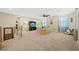 Large bonus room features plush carpeting, a ceiling fan, and comfortable seating for movie watching at 5523 Kyle Peak Ct, Las Vegas, NV 89135