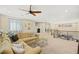 Spacious bonus room featuring plush carpeting, a ceiling fan, and comfortable seating, perfect for relaxation and entertainment at 5523 Kyle Peak Ct, Las Vegas, NV 89135