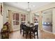 Dining room with dark wood table and sliding doors to the backyard at 5523 Kyle Peak Ct, Las Vegas, NV 89135