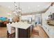 Open kitchen showcasing a large island, breakfast bar, and seamless flow into the living areas at 5523 Kyle Peak Ct, Las Vegas, NV 89135