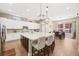 Bright kitchen with an island, sleek countertops, and seamless access to the dining area at 5523 Kyle Peak Ct, Las Vegas, NV 89135