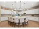 Modern kitchen with a large island, pendant lighting, and stainless steel appliances at 5523 Kyle Peak Ct, Las Vegas, NV 89135