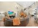 Cozy living room with high ceilings, chandelier, comfortable seating, and lots of natural light at 5523 Kyle Peak Ct, Las Vegas, NV 89135