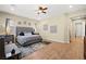 Bright and airy main bedroom with hard wood floors, ceiling fan, and a large bed with decorative pillows at 5523 Kyle Peak Ct, Las Vegas, NV 89135